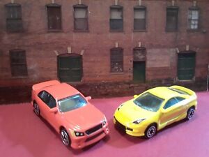 1:64 Scale Car Lot of (2) Lexus/ Toyota Celica Lot of (2). Red and Yellow. 