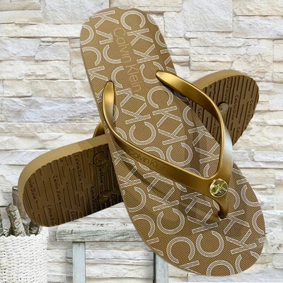 NWT CALVIN KLEIN MSRP $39.99 SARMINYA WOMEN'S GOLD FLIP FLOPS SANDALS SIZE 6 7 - Image 1 of 4