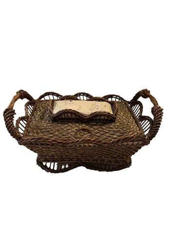 Antique wicker sewing basket filled with antique sewing needles Cover