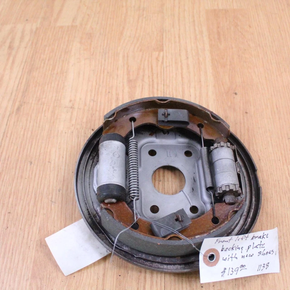 1984 HONDA TRX 200 Front Left Brake Plate Panel Cylinder Assy & New Brake Shoes - Image 1 of 4
