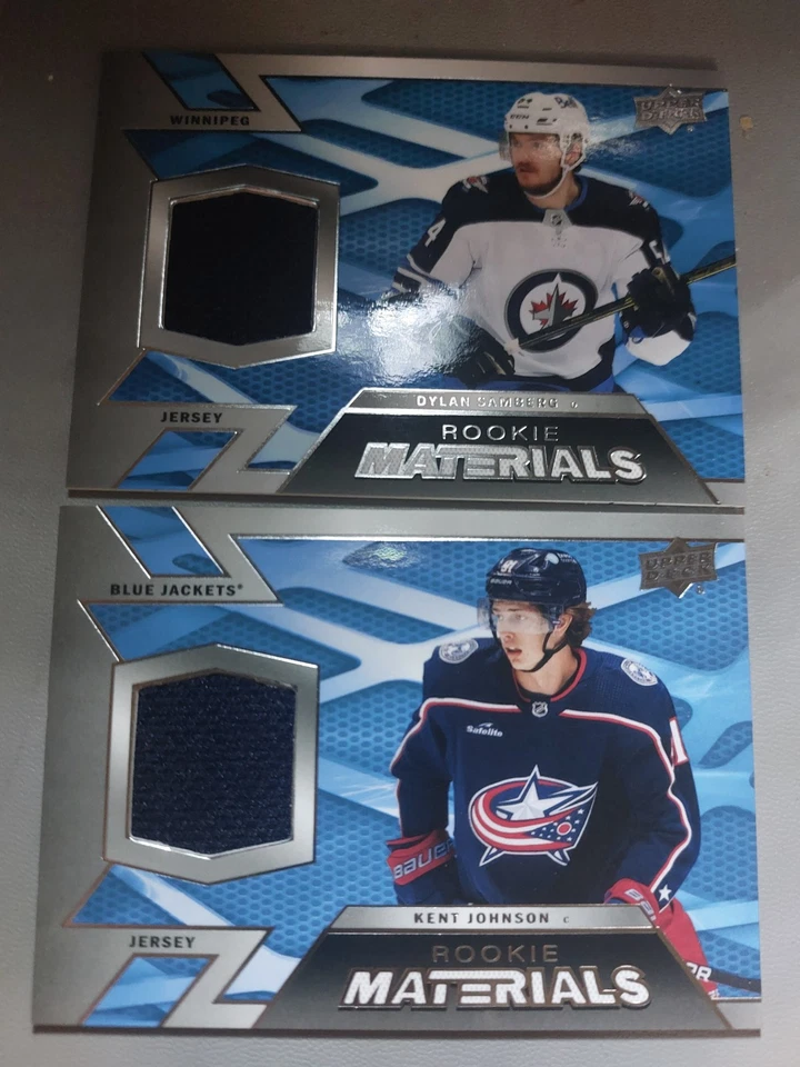2022-23 Rookie Materials Kent Johnson + Dylan Samberg Jerseys Cards Lot - Image 1 of 1