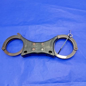 Esposas rígidas Quik-Kuf - negras - emisión ex policía - 1 llave incluida - grado 1 - Imagen 1 de 7