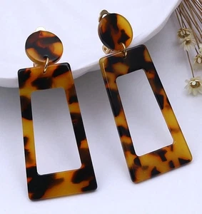 Clip on 2 1/2" gold and plastic brown dangle earrings - Picture 1 of 3