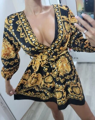 Vestido de moda para mujer dorado negro estilo diseñador cuello en V profundo  Foto 1 de 4