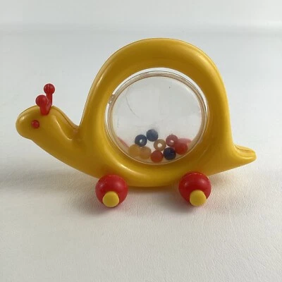 Sonajero giratorio caracol empujar a lo largo bebé vintage ambi juguetes amarillo animal rojo ruedas Foto 1 de 4