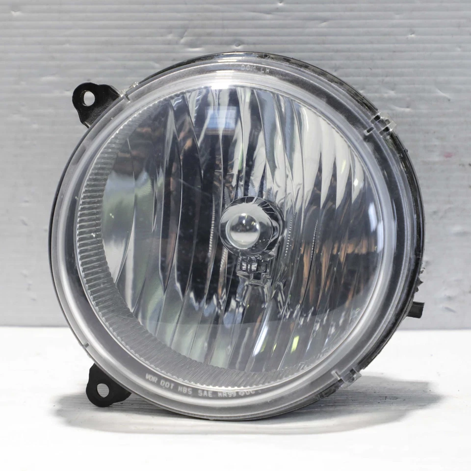 Conjunto de faros halógenos laterales izquierdos Jeep Liberty 2005-2007 OEM 55157141-AA Foto 1 de 4