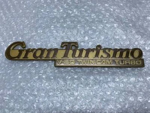 JDM New Former Nissan Metal Emblem Gold Gran Turismo V20 Twin Cam Turbo Y31 - Picture 1 of 4