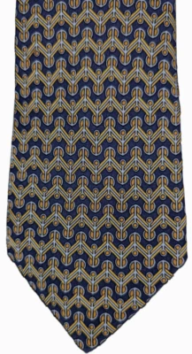 Corbata de seda HERMES azul marino con patrón en zigzag horizontal dorado y gris - Excelente estado Foto 1 de 4