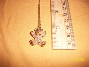 Gold colored metal teddy bear with green "gemstone" eyes necklace - Picture 1 of 4