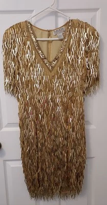 Vestido bomba de película Barbie con flecos dorados corbata negra de los años 80 Oleg Cassini talla 6 Foto 1 de 4