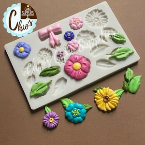 Flowers, leaves, and bow big silicone mold, 21 cavities, different designs. - Picture 1 of 4