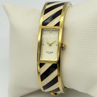 Reloj brazalete mujer KATE SPADE tono dorado, rayas negras/blancas con bisagras, 16 mm funciona Foto 1 de 4