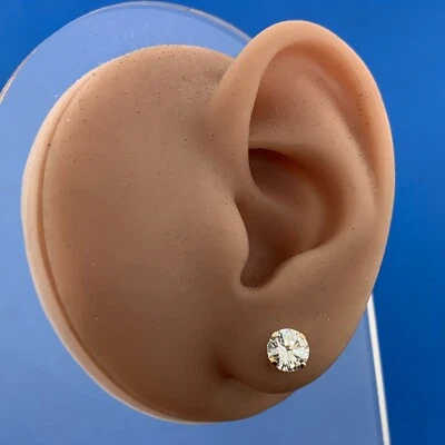 Aretes llamativos redondos de circonita cúbica de oro amarillo de 10 quilates de diseñador Foto 1 de 4