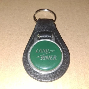 VINTAGE *LAND ROVER*BLACK LEATHER FOB/KEYRING WITH ENAMEL CENTRE - Foto 1 di 2