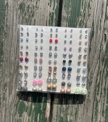 50 Pares de Aretes Joyería WONDER NATION Hipoalergénicos Rosas Corazones Redondos Foto 1 de 3