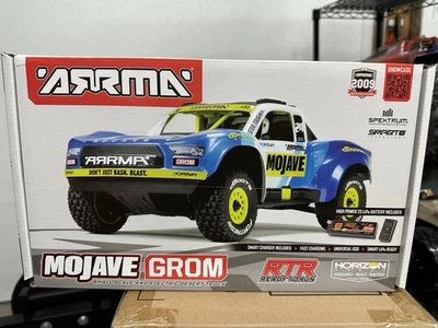 Camión eléctrico Arrma Mojave Grom MEGA 4x4 380 cepillado 1/18 Desert RTR azul/blanco Foto 1 de 4