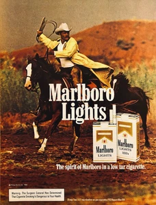 MARLBORO LIGHTS CIGARETTES—LASSOING COWBOY ON HORSE—VINTAGE 1984 PRINT AD - Bild 1 von 1