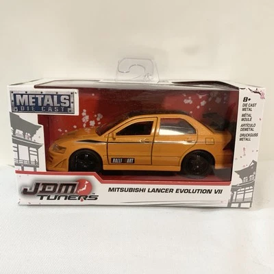 Jada JDM Tuners Orange 2018 Mitsubishi Lancer Evolution VII escala 1/32 fundido a presión Foto 1 de 4