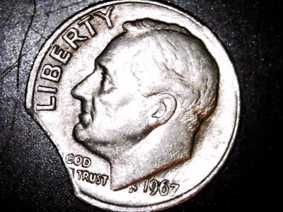 Planchet recortado Roosevelt 1967 moneda de diez centavos Foto 1 de 2