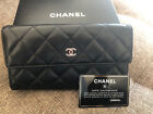 CHANEL Classic Quilted Flap wallet in Black Quilted Lamb Skin Silver Hardware