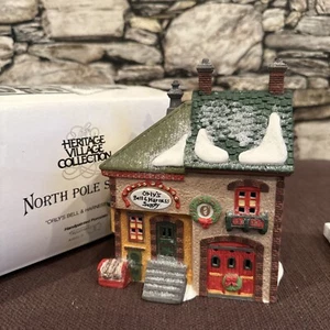 Department 56 - Orly's Bell & Harness Supply - North Pole Series - Picture 1 of 6