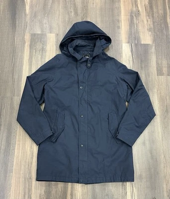 Chaqueta de lluvia The North Face Trench para hombre azul marino con capucha Hyvent cremallera abrigo mediano Foto 1 de 4