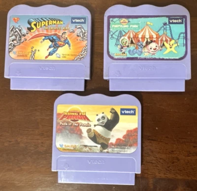 Lot of 3 VTech V.Smile games: Kung Fu Panda, Superman, Partyland Park - Image 1 of 4
