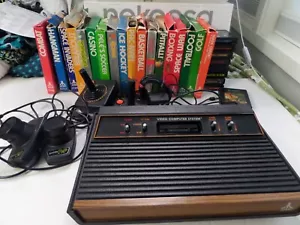 Atari 2600 (4 Switch) With 2 Joysticks, Paddles, 27 Games, Instructions, Tested - Picture 1 of 9
