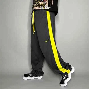 Nike Jogginghose Herren XL dunkelgrau Polyester gelb Swoosh Baggy Therma Passform - Bild 1 von 4