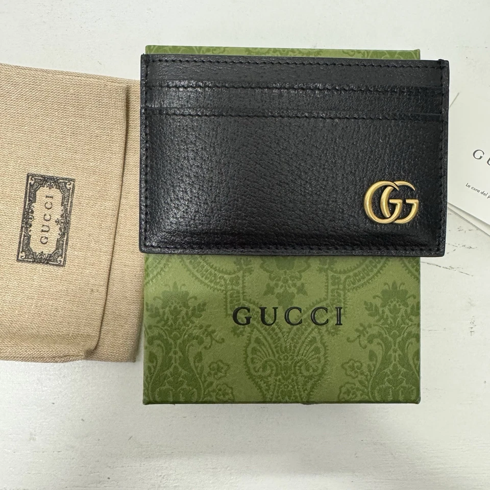 Tarjetero Gucci GG Marmont en dorado/negro Foto 1 de 4