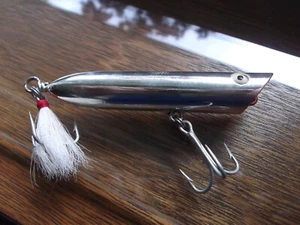 Older Cotton Cordell Floatin' Nuthin Pencil Popper Chrome Silver - Picture 1 of 4