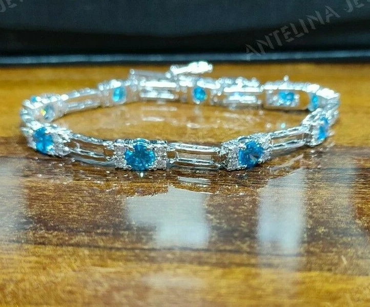 Brazalete Tenis 6 Ct Corte Redondo Topacio Azul Londres y Diamante Acabado Oro Blanco 14k Foto 1 de 4