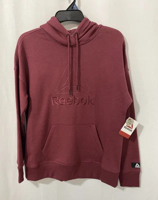 Chaqueta con capucha Reebok para mujer con logotipo y bolsillo frontal frambuesa caramelo XS (0-2) Foto 1 de 4