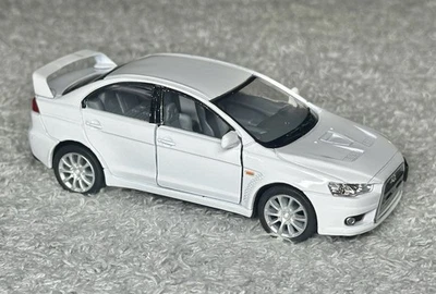Mitsubishi Lancer Evolution X Ki Nsmart 2008 escala 1:36 blanco kinsmart Foto 1 de 4