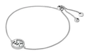 NWT MICHAEL KORS SILVER-TONE BRASS CRYSTAL PAVE LOGO SLIDER BRACELET MSRP $85.00 - Picture 1 of 8