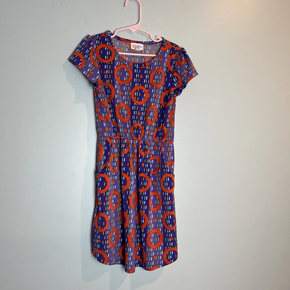 Vestido LuLaRoe Niñas Talla 8 Púrpura y Naranja Estampado Círculo con Mangas de Gorra y Bolsillos Foto 1 de 4