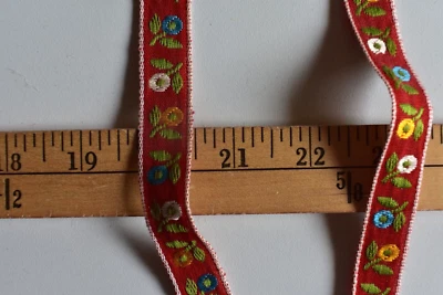JACQUARD  FLORAL DESIGN  BRAID  TRIM  ON RED   3 YARDS  X 5/8  INCHES WIDE - Image 1 of 2