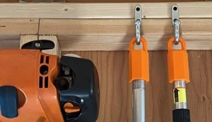 3 KOMBI LAGERHAKEN AUFHÄNGER FÜR STIHL EDGER TRIMMER GEBLÄSER SCHNEIDERWELLE ORANGE - Bild 1 von 9