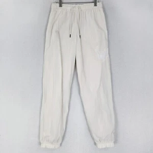 Pantalones deportivos Nike para mujer pequeños crema esenciales cortavientos - Imagen 1 de 13