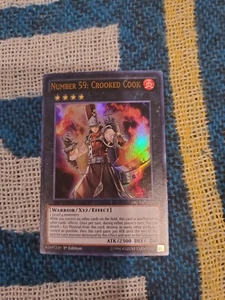 Number 59: Crooked Cook - YuGiOh! Dragons of Legend Unleashed DRL3-EN025 - NM/MT - Picture 1 of 2