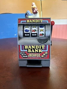 Bandit Bank Jackpot Neuheit Coin Bank! Getestet und funktionsfähig! Guter Zustand! Ansehen! - Bild 1 von 4