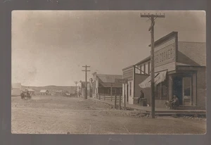 Ekalaka MONTANA RPPC c1910 MAIN STREET Stores BAR Sid's Place? nr Baker MT - Picture 1 of 3