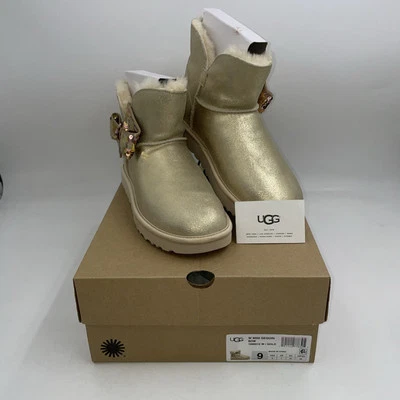 BOTAS UGG MINI LAZO DE LENTEJUELAS GAMUZA DORADA PIEL DE OVEJA TALLA US 9 PARA MUJER Foto 1 de 4