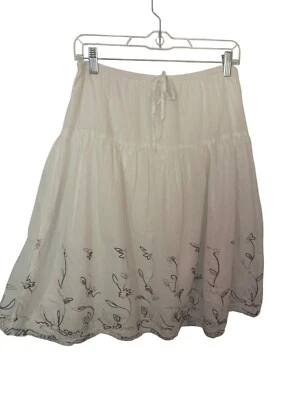 White Embroidered Floral Cotton Skirt With Elastic Waist & Tie Detail By JKLA... - Image 1 of 4