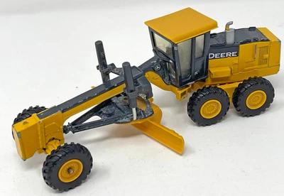 Tractor niveladora Ertl John Deere 872D fundido a presión amarillo usado Foto 1 de 4