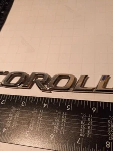 07 08 09 10 11 12 13 14 15 16 TOYOTA COROLLA REAR EMBLEM LOGO BADGE SET OEM - Imagen 1 de 2