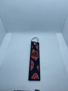 Schlüsselanhänger Naruto Anime Manga rot Akatsuki Wolke bestickt Jet-Tag - Bild 1 von 1