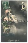 TINTED FRENCH POSTCARD D+7786 WOMAN WITH FLOWERS MAN WITH GIFTS - HAPPY NEW YEAR