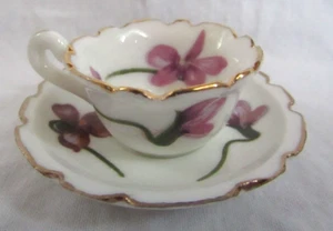 VINTAGE BONE CHINA MINIATURE PURPLE VIOLETS CUP AND SAUCER MADE TAIWAN - Bild 1 von 3