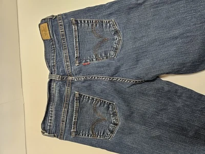 Pantalones de mezclilla elásticos Levi's 512 perfectamente adelgazantes Bootcut para mujer azules talla 10  Foto 1 de 4